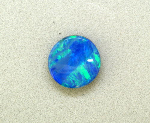 6mm Round Australian Opal Doublet (0.64 ct) 6mm Round Australian Opal Doublet (0.64 ct)