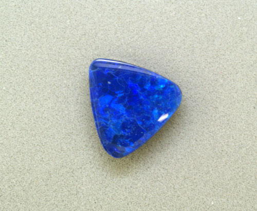 7mm Trillion Australian Opal Doublet (0.97 ct) 7mm Trillion Australian Opal Doublet (0.97 ct)